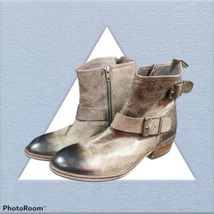 Leather boots distressed with buckles and straps